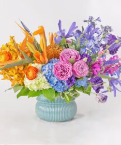 Bright birthday flower arrangement with roses, orchids, and hydrangeas—available for same-day delivery in Georgetown, TX.